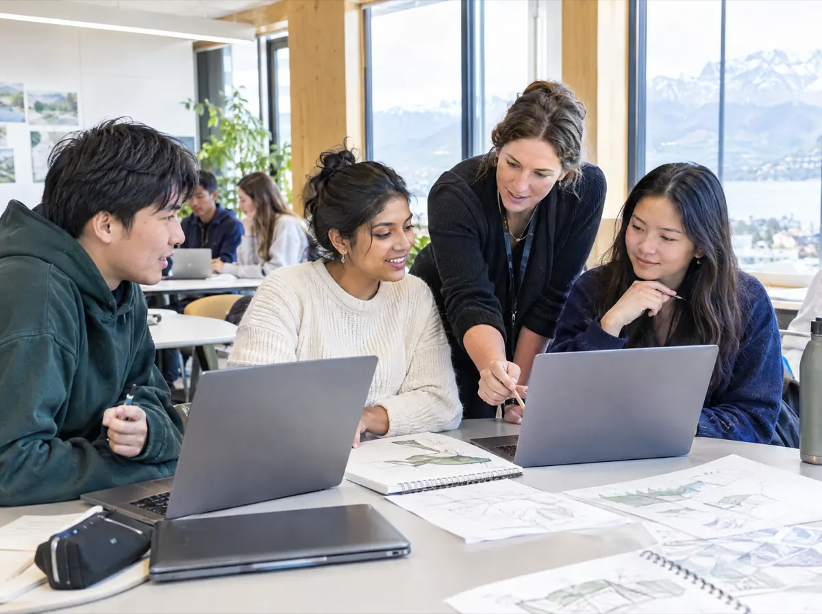 Students working together with a tutor in a bright New Zealand college classroom
